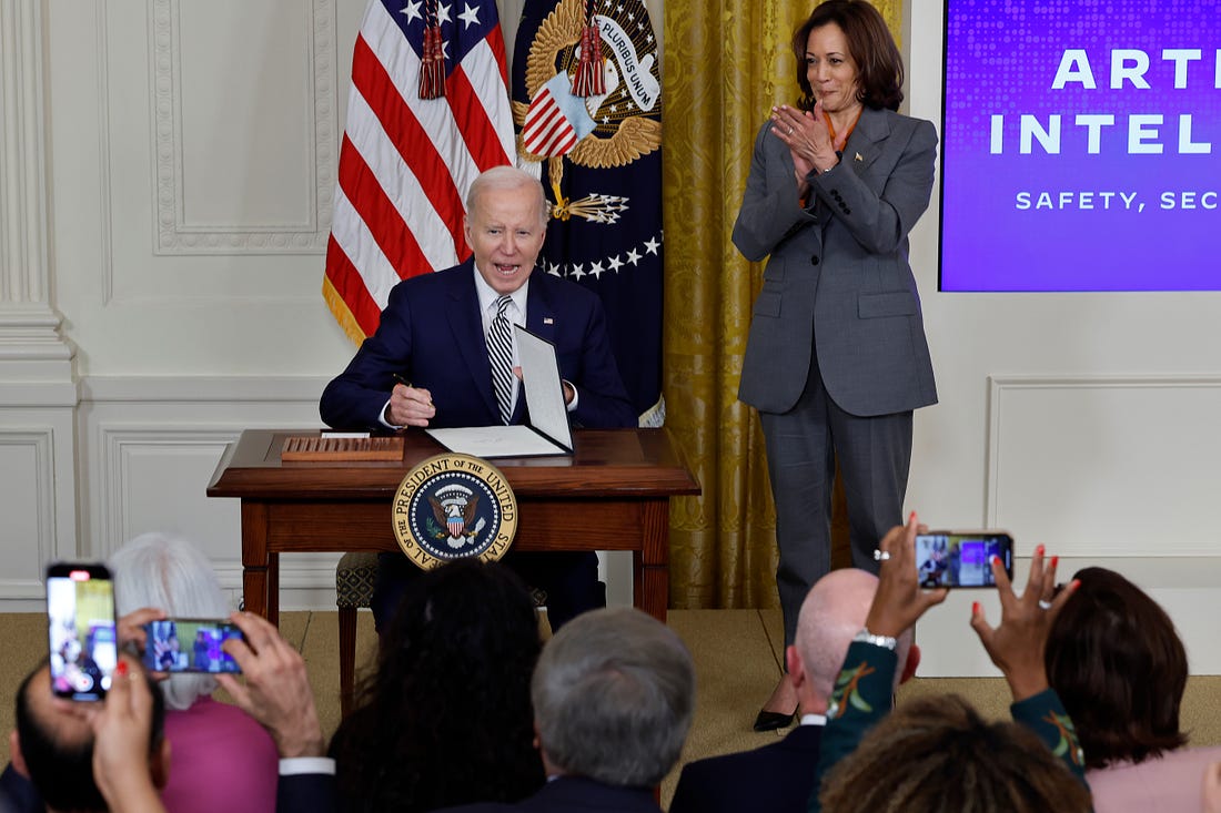 Vice President Kamala Harris looks on as President Joe Biden signs a new executive order guiding his administration's approach to artificial intelligence during an event in the East Room of the White House on Monday. (Chip Somodevilla / Getty Images)
