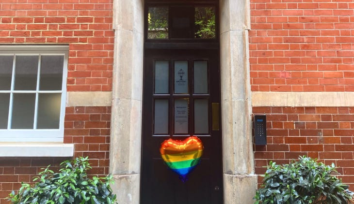 A heart-shaped rainbow balloon outside the door of the Bow Street Police Museum