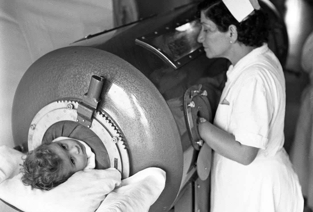 Nurse tending to a child with polio