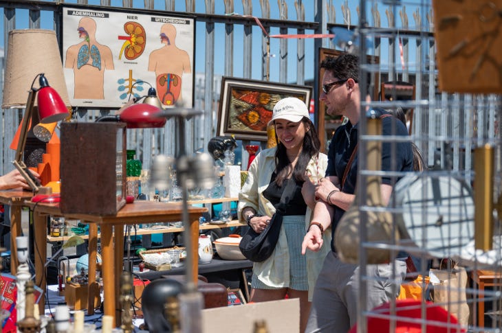 People browsing at an outdoor flea market