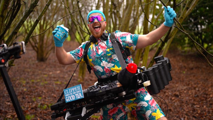 A man in a jump suit with portable decks in the woods