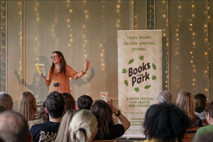 A woman giving a talk in front of an audience