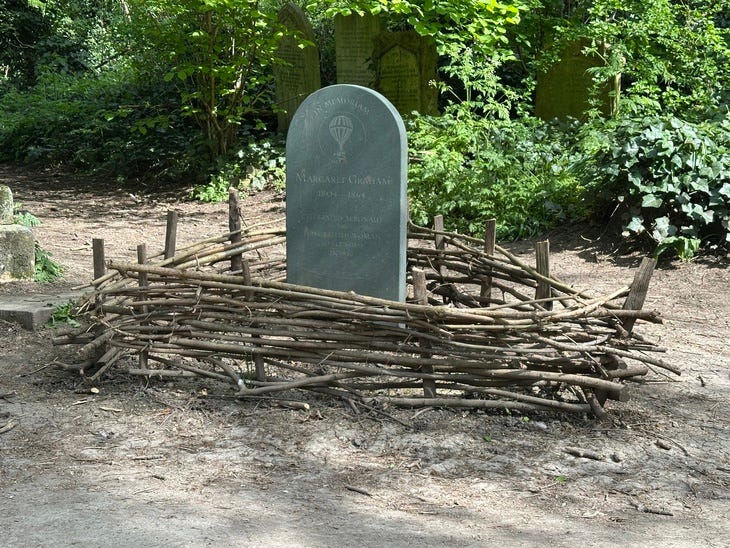 A gravestone surrounded by wicker