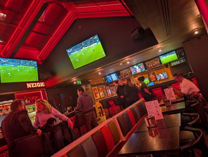 A sports bar with red strip lighting