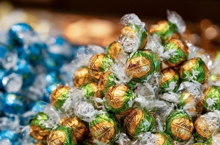 A collection of gold and blue Lindt balls