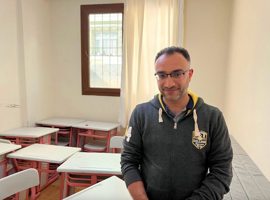 Mohammed Noor Yaserji stands in the orphanage he created over the past year.