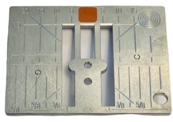 Fabric pushed down into a wide needle plate hole versus supported by a straight stitch plate
