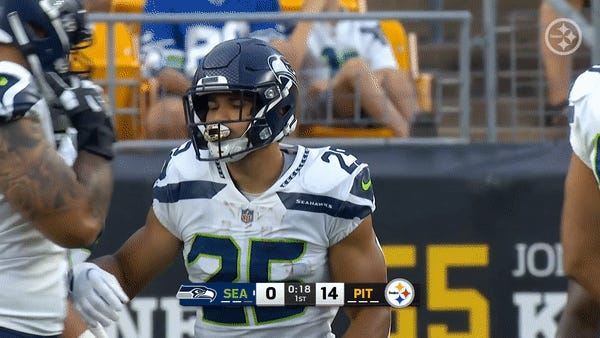 Seattle Seahawks running back Travis Homer reacts during an NFL