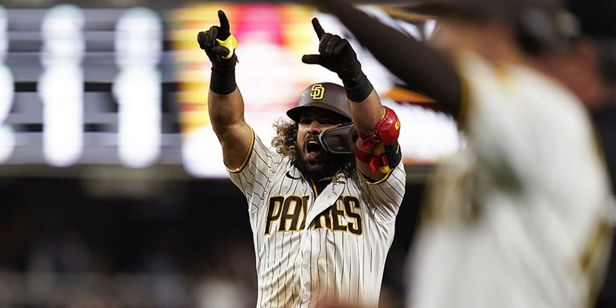 Jorge Alfaro of the San Diego Padres walks to the duguout after