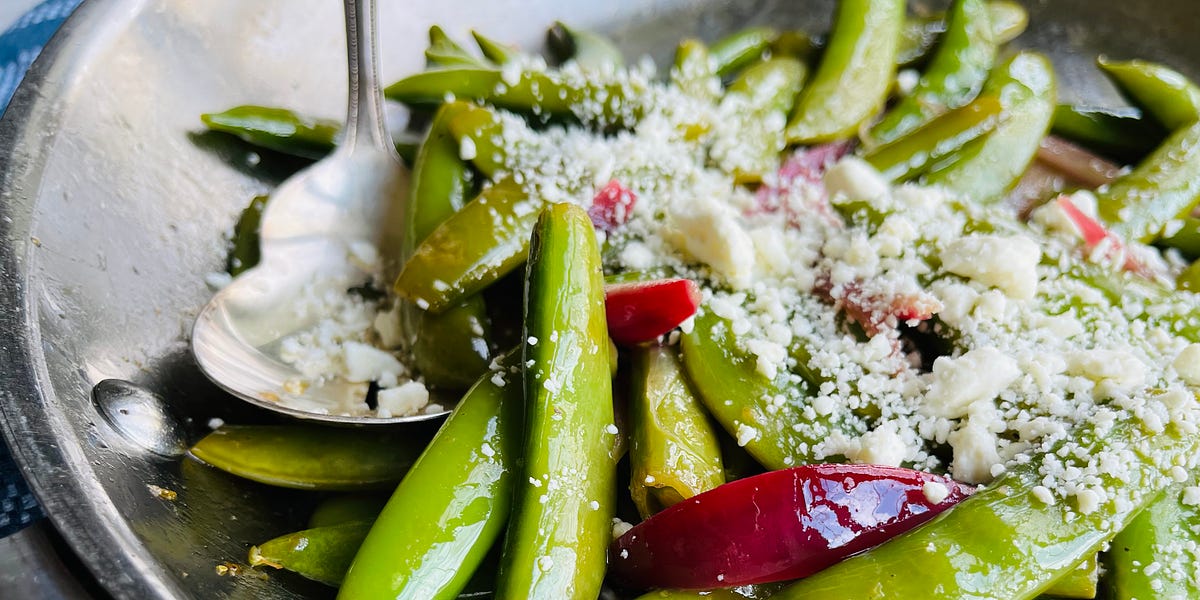 Sauteed snap peas and red onion topped with crumbled feta cheese.