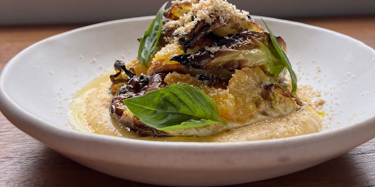 Marinated pointed cabbage with spices, blood orange sabayon and hazelnuts