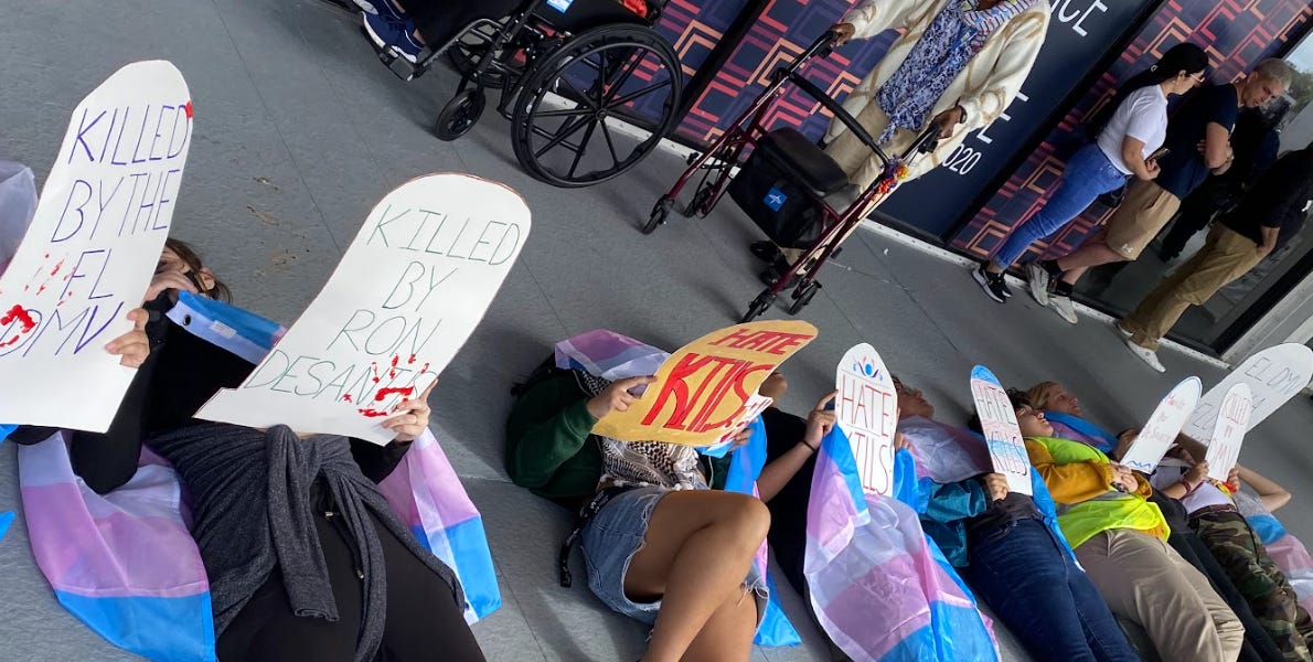 Protestors Stage DieIns At Several Florida DMVs Over Trans Drivers