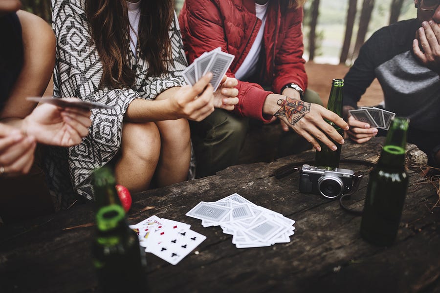 Playing cards getting dealt onto the table.