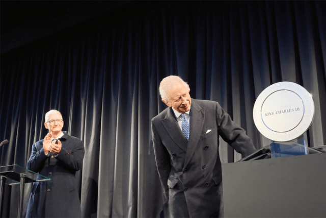 Tim Cook presents King Charles with a plaque to commemorate his visit.