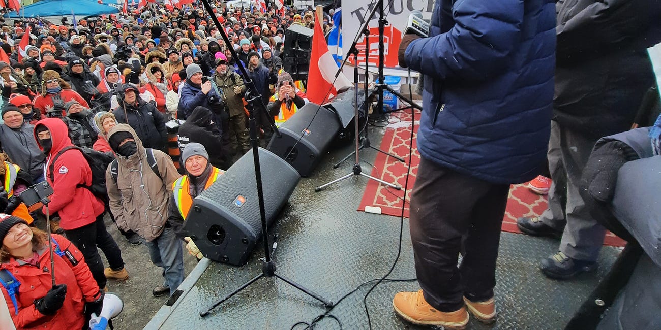 Dr. Paul Alexander photos Ottawa truck convoy February 12th 2022 with police security team and others before and after speaking on the parliament hill stage; tens of thousands, 1 million in Ottawa 