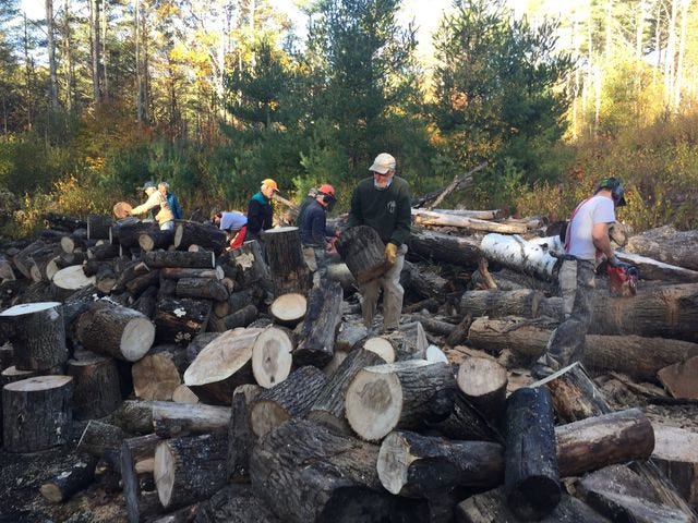 They cut,they split,and they stacked,so that others can stay warm this winter
