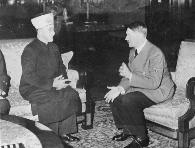 Adolf Hitler meets with the Grand islamic Mufti of Jerusalem, Haj Amin al-Husseini, on November 28, 1941. This photo is 'real', no dispute. Why did they meet? What did the Mufti tell Hitler? What did 
