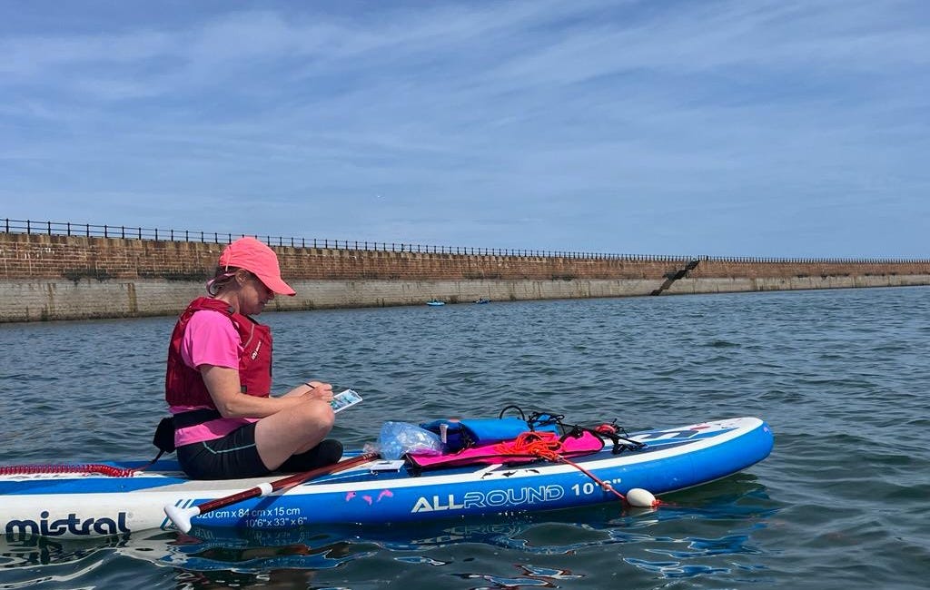 Paddleboarding artist prepares for first solo show