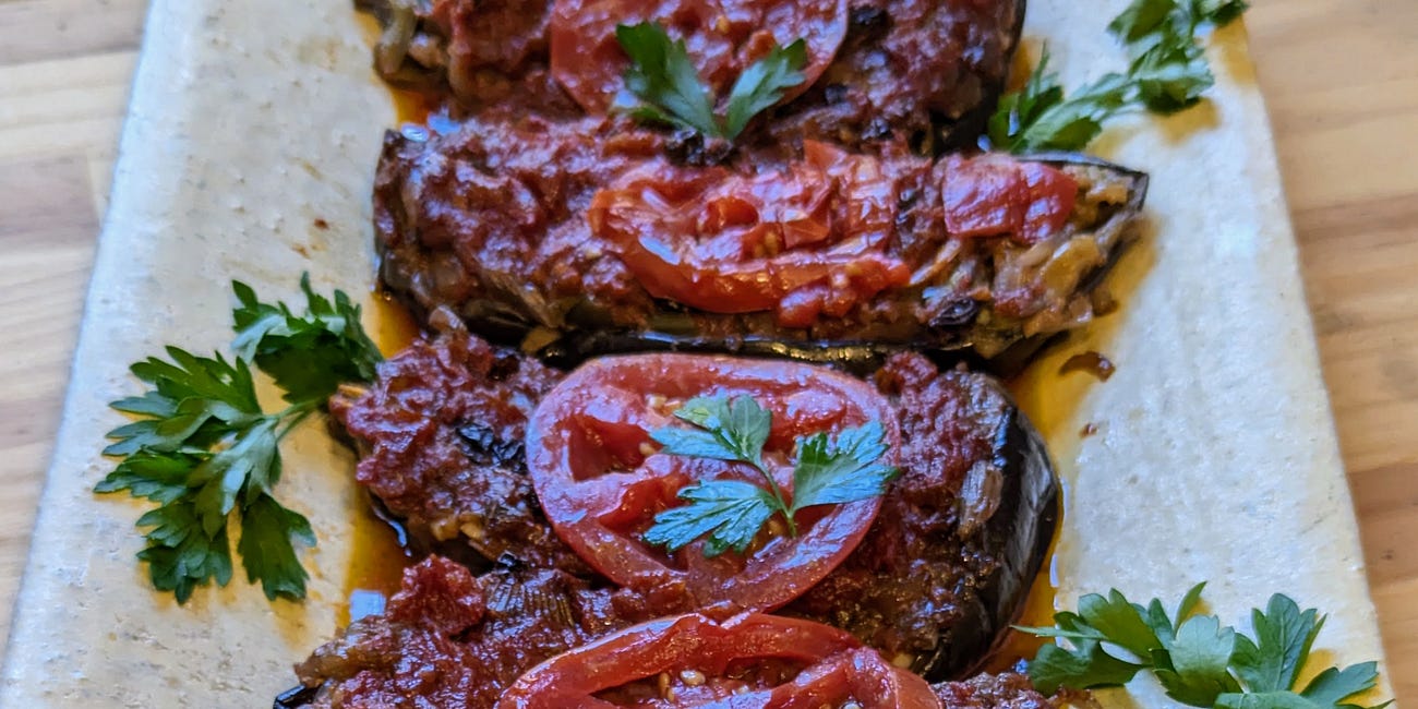 Eggplants in Tomato Sauce with Onions, Walnuts, and Cheese