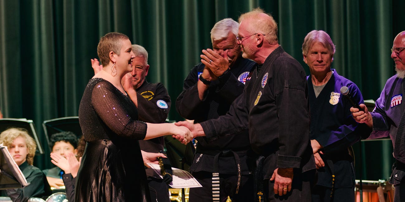 Kerr band director obtains honorary black belt after battling with cancer