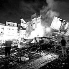 Israeli official says it "destroyed a five-storey apartment building with families living inside because there was a spotter on the roof."