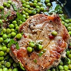 Pan fried pork steaks with chilli, mint & peas.