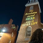 With vintage-style fonts and an anti-Trump message, this collective turns historic buildings into protest zones