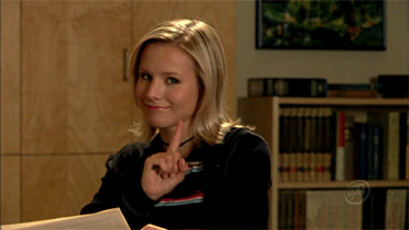 Kristen Bell as Veronica Mars shaking her pointer finger. Kristen Bell as Veronica Mars shaking her pointer finger.