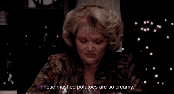 The mom in While You Were Sleeping holding up a fork and saying "These mashed potatoes are so creamy."