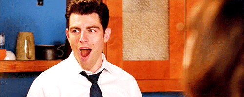 Max Greenfield in "New Girl" covering his mouth