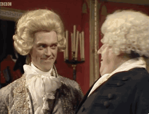 Two white men with curly, powdered white wigs dating back to the 18thcentury are laughing with each other. Graphic says, "nope didn't catch any of that" 