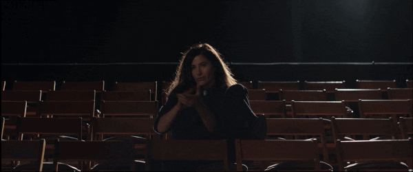 Kathryn Hahn slow-clapping in an empty auditorium