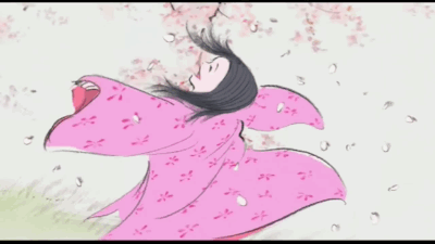 Kaguya dances wildly and joyfully under a cherry blossom tree shedding its petals all over her. She spins with her arms out in a poofy pink kimono that billows around her, her hair loosening around her face.
