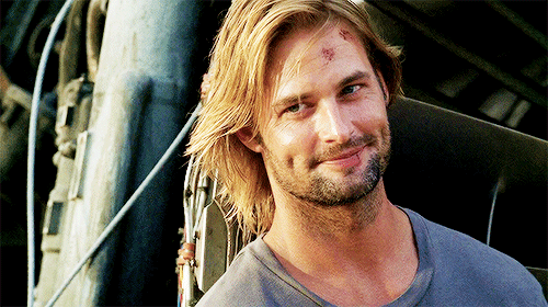 Josh Holloway as Sawyer smiles and looks down in 'LOST.' Josh Holloway as Sawyer smiles and looks down in 'LOST.'
