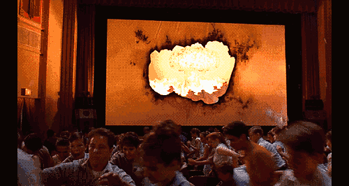 GIF: Audience flees the theater in 1993's Matinee.