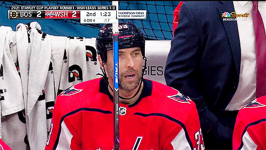 a flashing gif of Zdeno Chara from the second game of the series between the Capitals and the Bruins. Chara is on the bench, sighing and looking beleaguered, and one of his teammates throws a branded gatorade towel at him which briefly covers his face. 