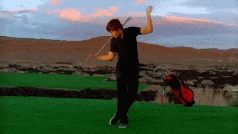 Gif of Zac Efron as Troy Bolton dancing with a golf club in the iconic HSM2 song "Bet On It"