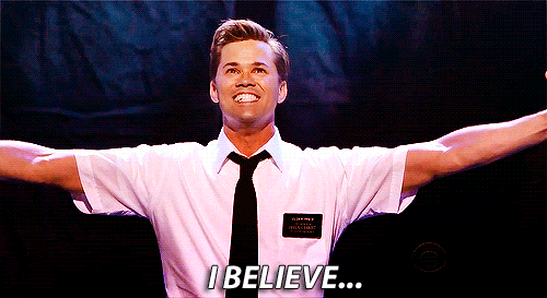 A gif of an actor from Book of Mormon, raising his arms while singing. The caption reads "I believe."
