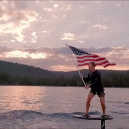 Hope he doesn&#39;t land into ring of water fire&#39;: Mark Zuckerberg surfs  holding American flag on 4th July; inspires meme fest