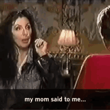 Gif of Cher saying when her mum told her to settle down and marry a rich man, she replied "Mom, I am a rich man."