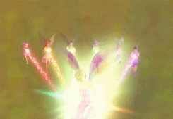 The 7 apprentices fill a weakened Elena with their powers by performing Luminescence. They are arranged in a row as they flutter and beam their colors into Elena who rises into the frame, lifted by the collective power, transformed into a 7-color fairy with rainbow wings and a rainbow outfit. She frowns with determination as the camera zooms in on her.