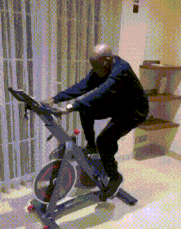 An animation of an old man riding an exercise bicycle 
