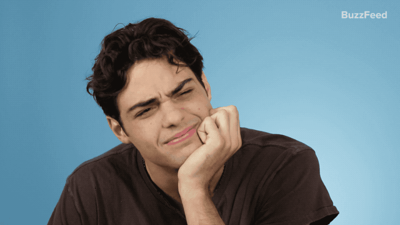 Noah Centineo looking confused against a blue background. Noah Centineo looking confused against a blue background.