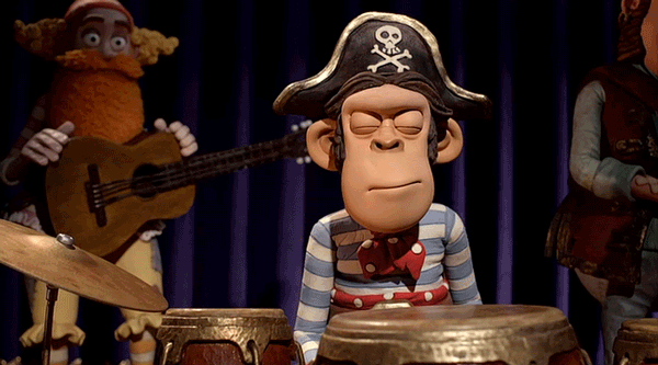 a monkey in a pirate hat giving a weary rimshot on a drum set