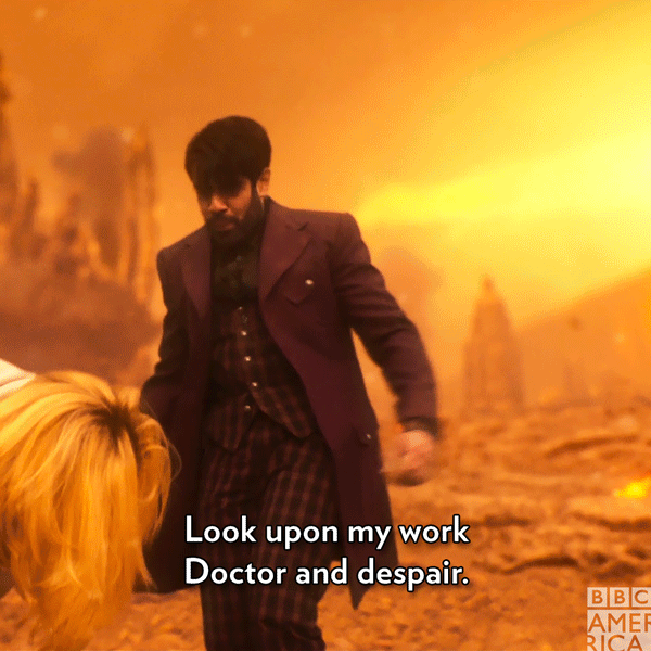 This GIF (repeated moving image) shows the Master (played by Sacha Dhawan) standing in front of the Thirteenth Doctor (played by Jodie Whittaker) on the blasted surface of Gallifrey. With the ruined Citadel of the Time Lords behind him, the Master spreads his arms and repeats the words "Look upon my work Doctor and despair." This GIF (repeated moving image) shows the Master (played by Sacha Dhawan) standing in front of the Thirteenth Doctor (played by Jodie Whittaker) on the blasted surface of Gallifrey. With the ruined Citadel of the Time Lords behind him, the Master spreads his arms and repeats the words "Look upon my work Doctor and despair."