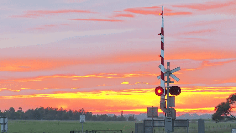[OC] Railroad Crossing Against a Vivid Sunset : Cinemagraphs