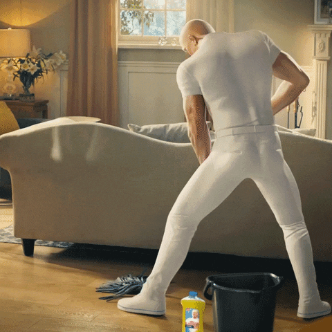 Mr. Clean cleaning vigorously.
