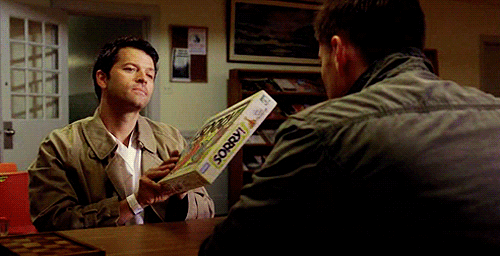 GIF from Supernatural: Castiel holds up the board game "Sorry!"