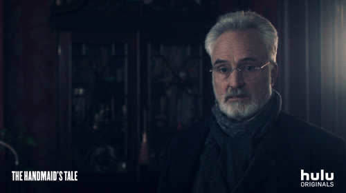 Bradley Whitford in a dimly lit room in 'The Handmaid's Tale' saying "You think that's fair?" Bradley Whitford in a dimly lit room in 'The Handmaid's Tale' saying "You think that's fair?"