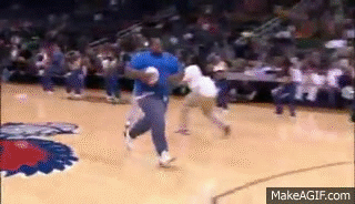 Fat guy trying to dunk off a trampoline at the Hawks game = awesome on Make  a GIF